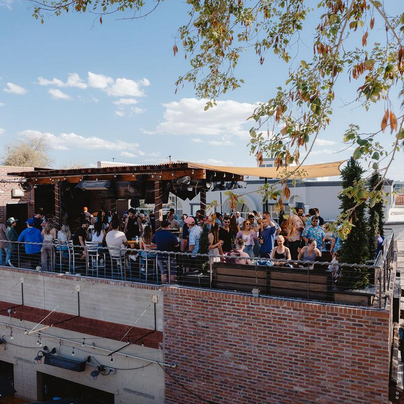 Guests enjoying the rooftop patio at Rockbar Inc.
