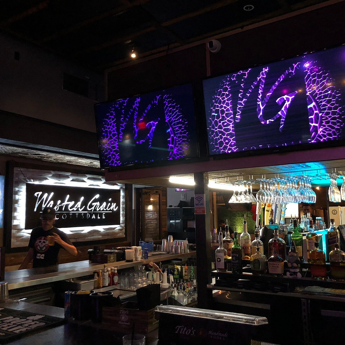 The main bar and video screens inside Wasted Grain