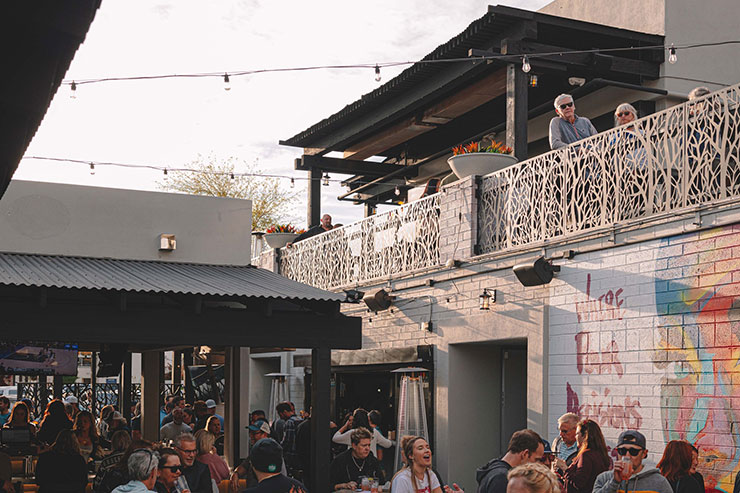 Guests enjoying the patio at Poor Decisions Patio and Kitchen
